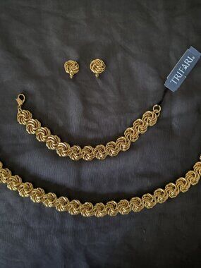 Two sets of Trifari costume jewelry, gold tone